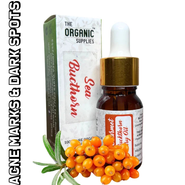A glass bottle of "Sea Buckthorn Oil" with an orange label and dropper top sits on a white background, next to a small cluster of orange sea buckthorn berries.