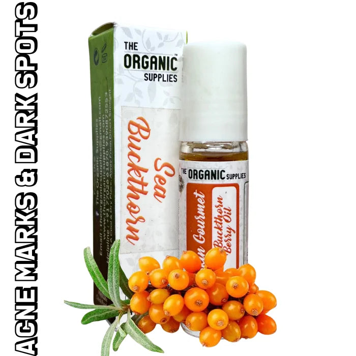 A glass roll on bottle of "Sea Buckthorn Oil" with an orange label and dropper top sits on a white background, next to a small cluster of orange sea buckthorn berries.