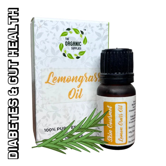A bottle of lemongrass oil on a white background, next to a small cardboard box. along with lemon grass leaves. 