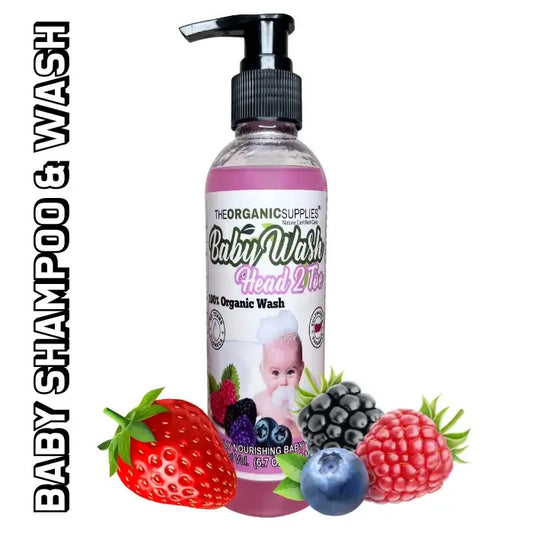 the pump bottle of baby shampoo and wash from the organic supplies head to toe wash along with strawberries and blue barrier. best for infant age 