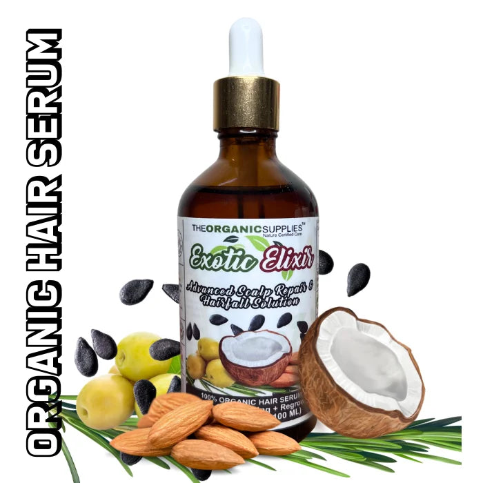 A bottle of exotic elixir hair growth serum, surrounded by fresh coconut, almonds, olives, black seeds, Rosemarry. Organic hair serum. Shop organic hair care products at The Organic Supplies.